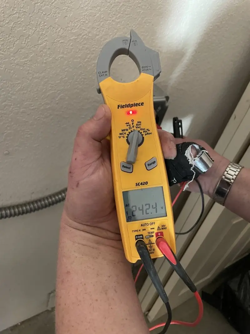 Voltage testing with clamp meter during Ceiling Fan Installation in South Blooming Grove